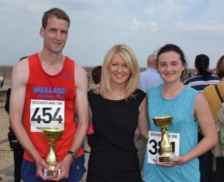 Greg Jones and Sophie Hunt with Esther McVey MP following the 10k