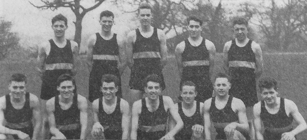 Cheshire Regiment Depot's full team of runners, seen with their championship cup. 
Back row: Pte. D. J. Standlast (Wallasey), Pte. A. Curtis (Seacombe), Pte. J. C. Deacon (Stockport), Pte. P. J. Hyden (Rugeley), Pte. P. W. Cooper (Clayton, Manchester). 
Front row: L/Cpl, D. J. W. George (AIrincham), Pte. A. W. Townsend (Wallasey), L/CpI. D B. White (Wallasey), Pte. M. J. Corcoran (Macclesfield), 
Pte. J. W. Guest (Chester), L/CpI. H. E Griffiths (Neston), Pte. R. W. Barlow (Moreton).